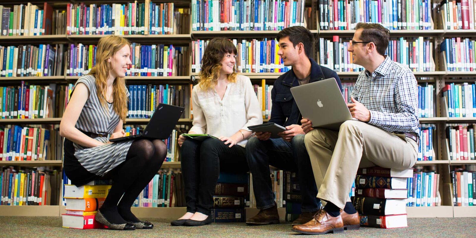 Middlebury Institute students collaborating in a library.